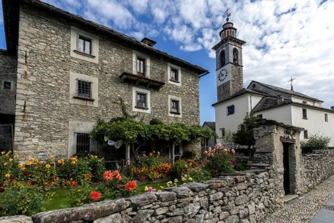 View of the village, typical Ticino stone houses in the mountain village of Rasa, Centovalli,