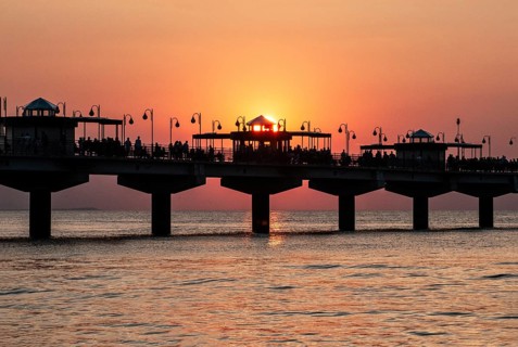 Sunset at the pier in Miedzyzdroje, Western Pomerania, Poland, East Europe, Europe