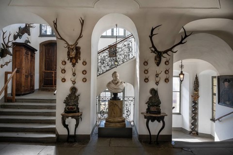 Staircase with hunting trophies and bust of the heraldist Carl Mayer von Mayerfels (1825-1883) in