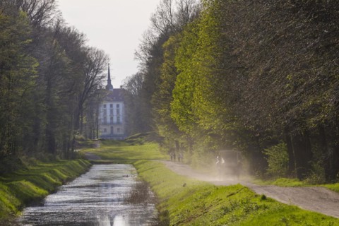 Canal between the hunting lodge and the Fasanenschlösschen with a carriage on a round trip,