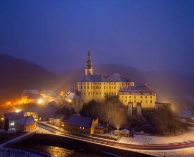 Winter evening in the Müglitz valley, impressively illuminated Weesenstein Castle at the blue hour,
