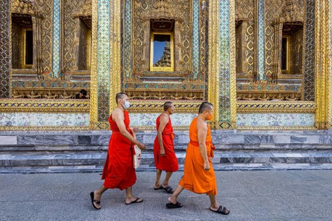 Wat Phra Kaeo temple, royal palace. Royal chapel with Buddhist monks and novices. Bangkok,