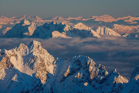 Mountain peak above high fog, evening light, winter, view from Zugspitze to Dreitorspitze and