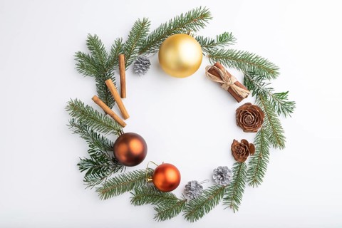 Christmas or New Year wreath composition. Decorations, balls, cones, fir and spruce branches, on