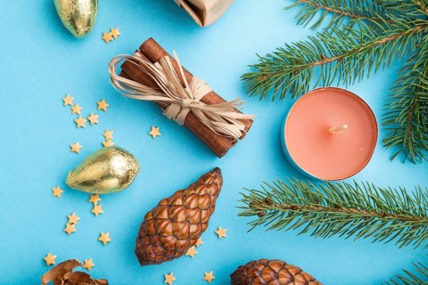 Christmas or New Year composition. Decorations, box, cinnamon, cones, fir and spruce branches, on a