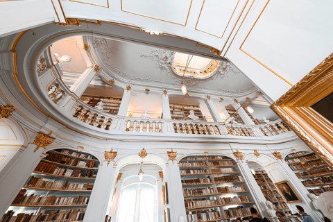 Magnificent baroque library with golden decorations and high bookshelves, Weimar, Germany, Europe