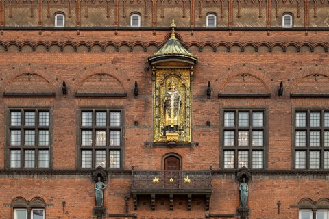 Brick façade with gilded sculpture of Bishop Absalon, Town Hall in the National Romantic style by