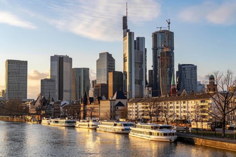 Skyline of the city centre of Frankfurt am Main, river Main, excursion boats at the Mainkai, dusk,