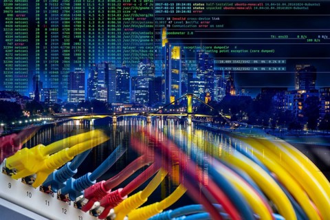 Symbolic image of critical infrastructure, skyline of Frankfurt am Main, data cable, hacker code