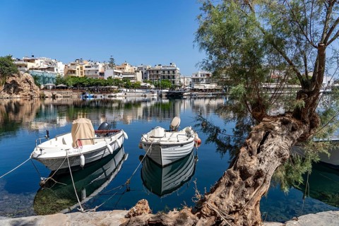 The village of Agios Nikolaos, in the eastern part of Crete, view over Lake Voulismeni, connected