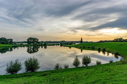 Lower Rhine landscape, reflection in the turning basin of the northern harbour of Walsum, view to