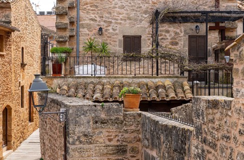 View of Mediterranean houses, roofs and courtyards from the town wall, Alcudia, Majorca, Spain,