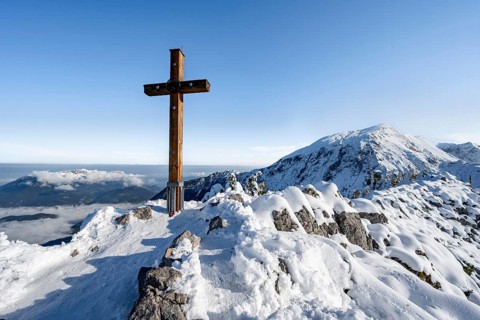Snow-covered summit of the Jenner with summit cross in autumn, Berchtesgaden National Park,