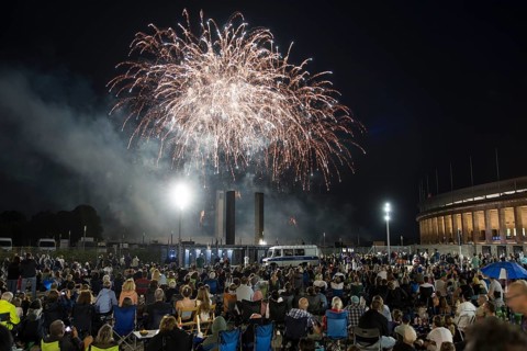 Spectators watch the fireworks at the Pyronale on the Maifeld at the Olympic Stadium, Berlin,
