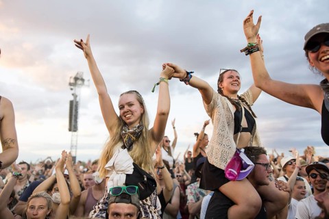 Festival visitors are carried on shoulders during the performance of the band Feine Sahne
