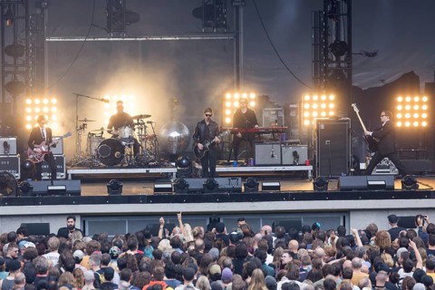 Daniel Kessler (guitarist), Samuel Sam Fogarino (drummer), Paul Banks (singer), Brandon Curtis