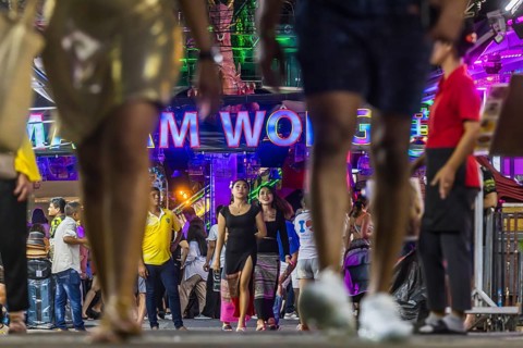 Crowds of people on Bangla Street in the evening. Nightlife on Bangla Walking Street with go-go