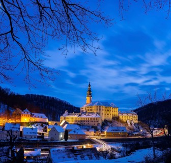 Winter evening in the Müglitz valley, impressively illuminated Weesenstein Castle at the blue hour,
