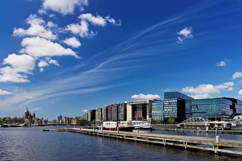 Booking com headquarters, at the back Basilica of St Nicholas (Dutch: Sint-Nicolaasbasiliek), Roman