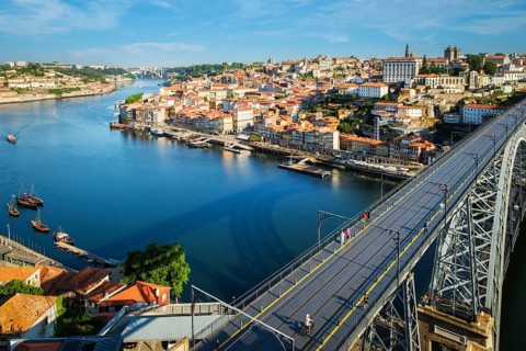 View of Porto city and Douro river and Dom Luis bridge I from famous tourist viewpoint Miradouro da