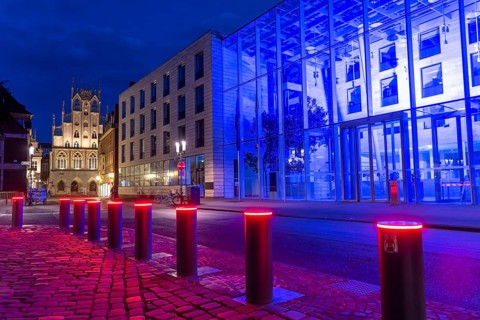 Historic old town, facade of the historic town hall, blue illuminated building of the Münster