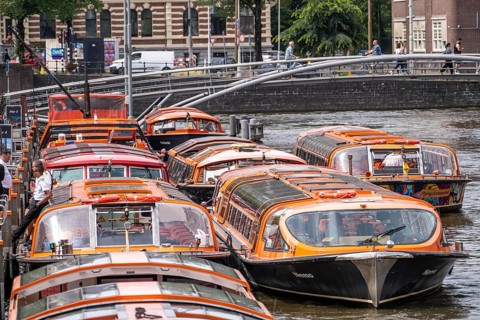 Canal cruises, pier of Lovers Canal Cruises, at Amsterdam Centraal station, Amsterdam Netherlands