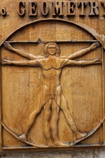 Close-up of Vitruvian man drawing by Leonardo da Vinci carved on a wooden plaque, Old Town of