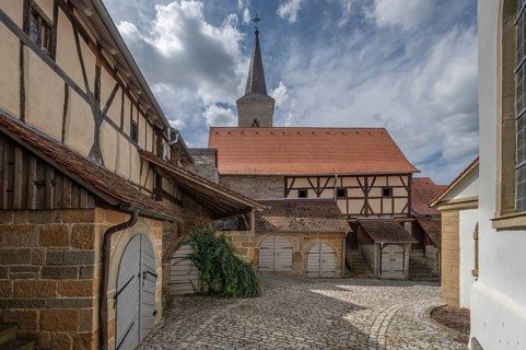 Former so-called Kirchgaden, barns in the historic fortified church, behind the tower of the church