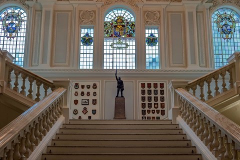 Elegant interior with majestic staircase, statue and stained glass windows, Belfast