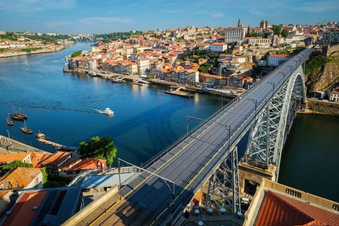 View of Porto city and Douro river and Dom Luis bridge I from famous tourist viewpoint Miradouro da