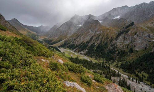 Green mountain valley with river and steep mountain peaks, Chong Kyzyl Suu Valley, Terskey Ala Too,