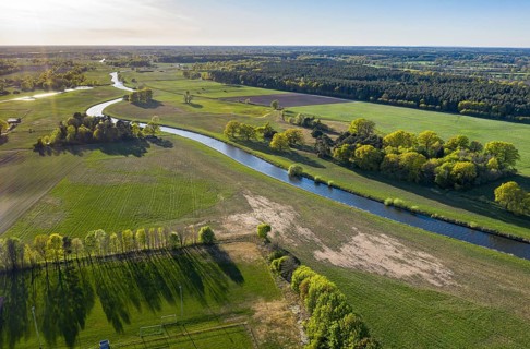 River Aller winding throug cultural landscape at Wienhausen east of Celle, mix of farmland, meadows