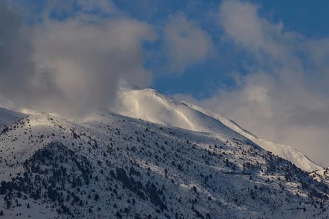Snow-covered mountain peaks under a blue sky with few clouds, Lefka Ori, White Mountains, mountain