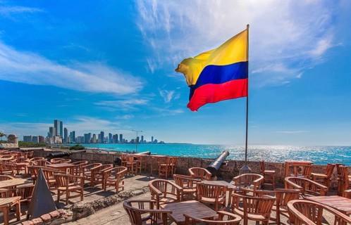 Street cafe in colonial Cartagena Walled City (Cuidad Amurrallada) overlooking scenic shoreline of