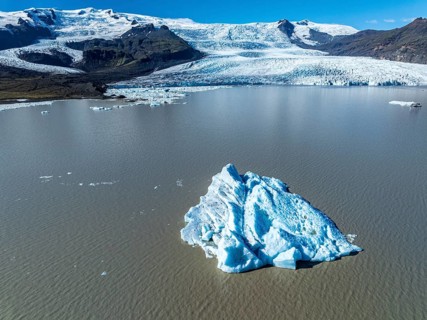 Aerial view over the glacial lake Fjallsárlón, glacier Fjallsjökull, part of Vatnajökull glacier,