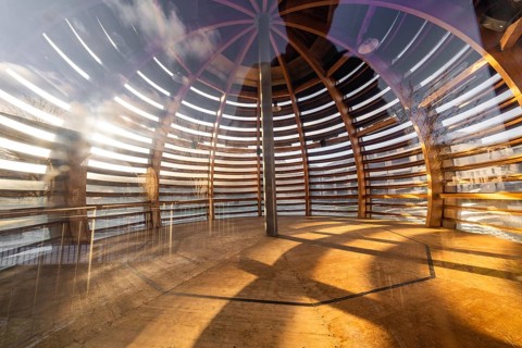 Interior view of a wooden sphere structure with incidence of light and shadow, translucent wood,