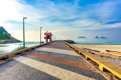 Breakwater pier on Barra da Tijuca beach in Rio de Janeiro at dawn Rio de Janeiro, RJ, Brazil,