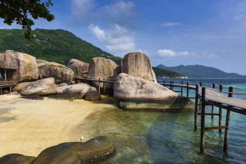 Wooden jetty with granite rocks at the entrance area of Nang Yuan Island, island, holiday island,