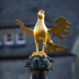 Gilded imperial eagle as a fountain eagle on the market fountain, Old Town, Goslar, UNESCO World