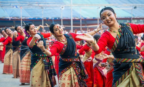 Participants with instructors dance on the final day of a Bihu dance workshop ahead of Rongali Bihu