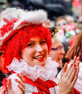 Colourfully costumed carnivalists celebrate carnival in Cologne, on Weiberfastnacht the street