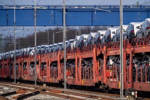 Car train, goods train on its way to the car terminal in Bremerhaven seaport, new German cars for