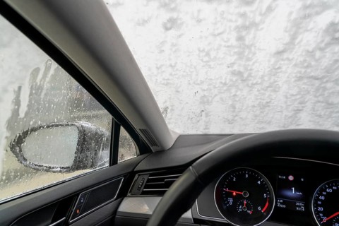 Car in an automatic car wash, car wash tunnel
