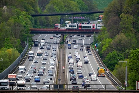 Local train S-Bahn, Regiobahn, S28, crossing the motorway A3, traffic on 8 lanes, incl. the