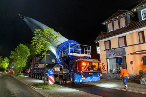 Transport of a 68 metre long, 22 tonne blade of a wind turbine, here in Breckerfeld-Waldbauer, with