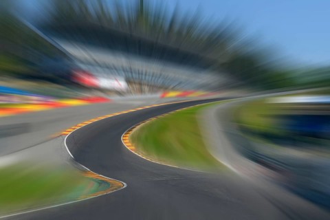 Photo of Eau Rouge with dynamic speed effect with view tunnel view from racing car perspective of