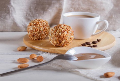 Energy balls cakes with nuts on wooden board on linen napkin. selective focus, close up