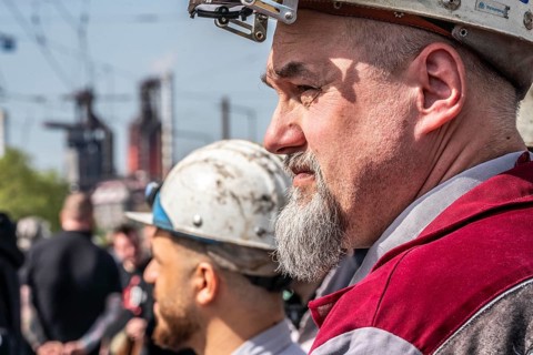 Steelworkers at a demonstration in front of the headquarters of ThyssenKrupp Steel Europe in