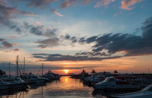 Sunset with cloud sky on the pier with yachts in malaysia
