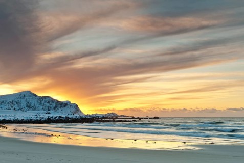 Sunset in winter at Skagsanden, stones on the beach at Flakstad, Flakstadøy, Lofoten, Nordland,